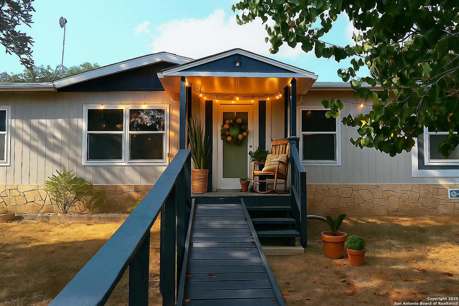 a front view of a house with large windows
