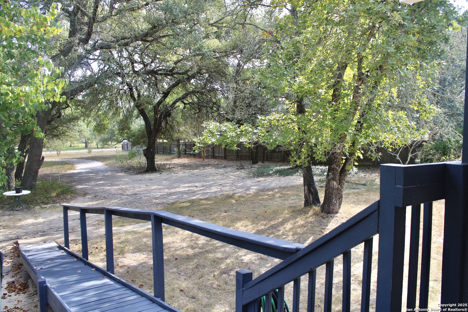 285 Rhonda Drive Lytle, TX 78052 - Photo 16 of 51 a view of a wooden deck and a backyard