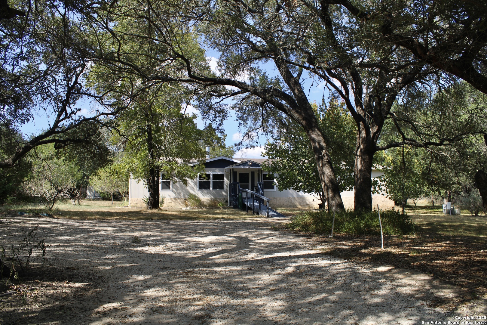 285 Rhonda Drive Lytle, TX 78052 - Photo 17 of 51 a front view of a house with a tree