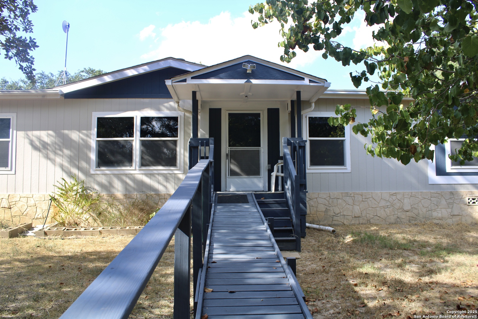 285 Rhonda Drive Lytle, TX 78052 - Photo 2 of 51 a front view of a house with wooden deck