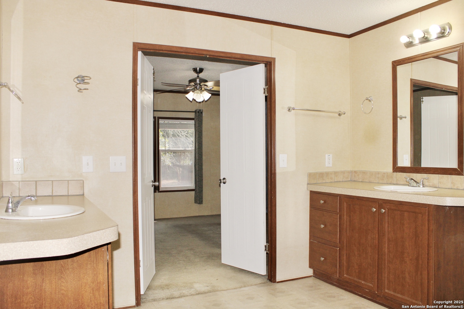 285 Rhonda Drive Lytle, TX 78052 - Photo 22 of 51 a bathroom with a sink and a mirror