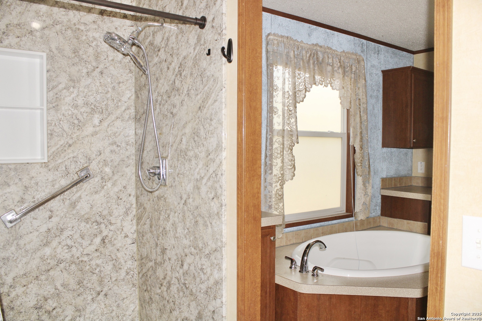 285 Rhonda Drive Lytle, TX 78052 - Photo 24 of 51 a bathroom with a tub and shower