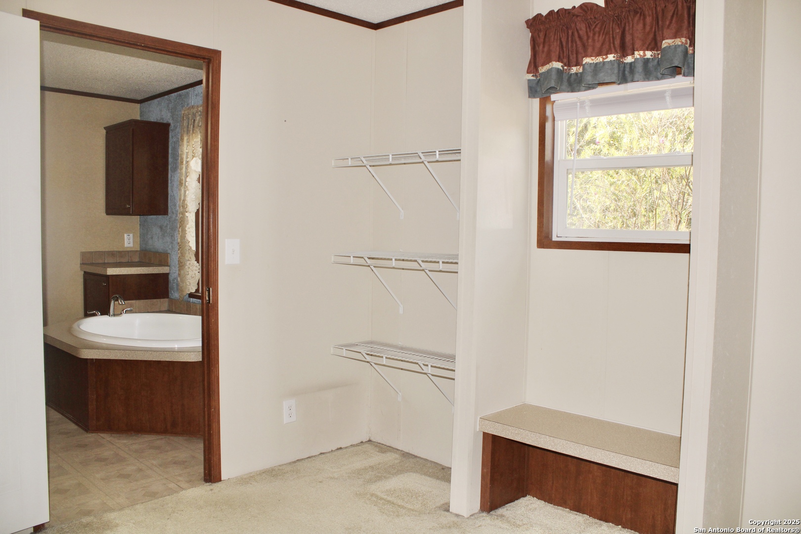 285 Rhonda Drive Lytle, TX 78052 - Photo 25 of 51 a view of bathroom with a sink and a mirror