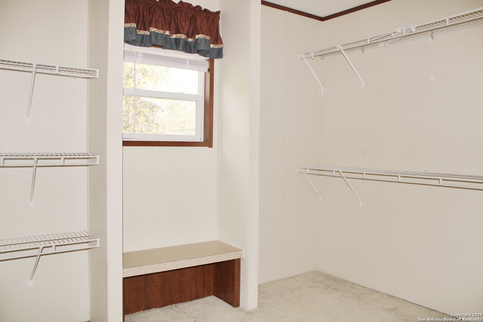 285 Rhonda Drive Lytle, TX 78052 - Photo 26 of 51 a view of walk in closet with empty racks