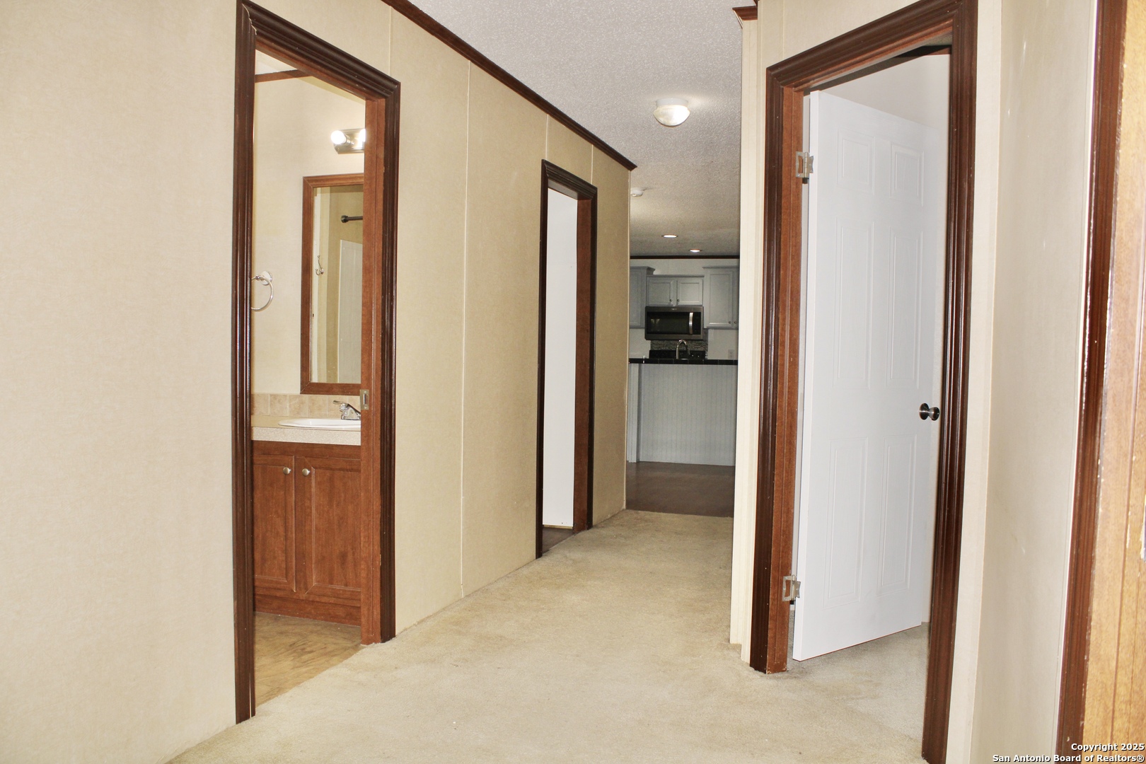 285 Rhonda Drive Lytle, TX 78052 - Photo 27 of 51 a view of a hallway with wooden shelves