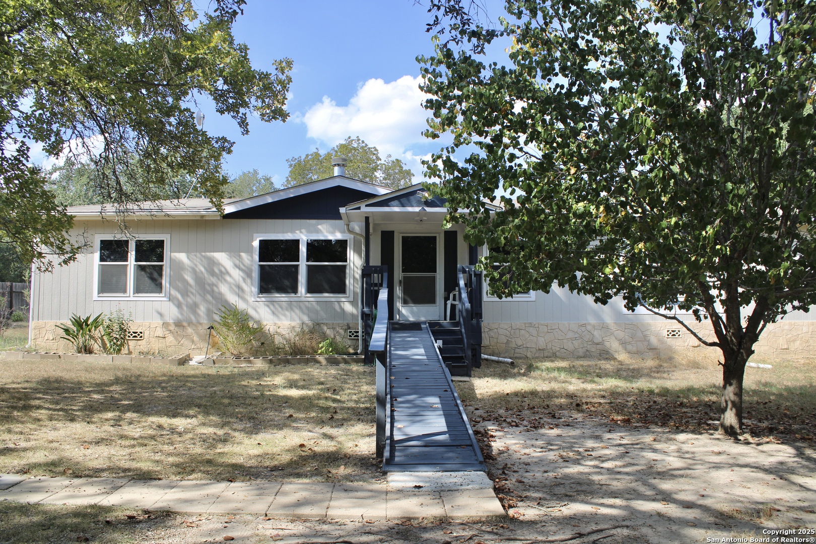 285 Rhonda Drive Lytle, TX 78052 - Photo 3 of 51 a front view of a house with garden