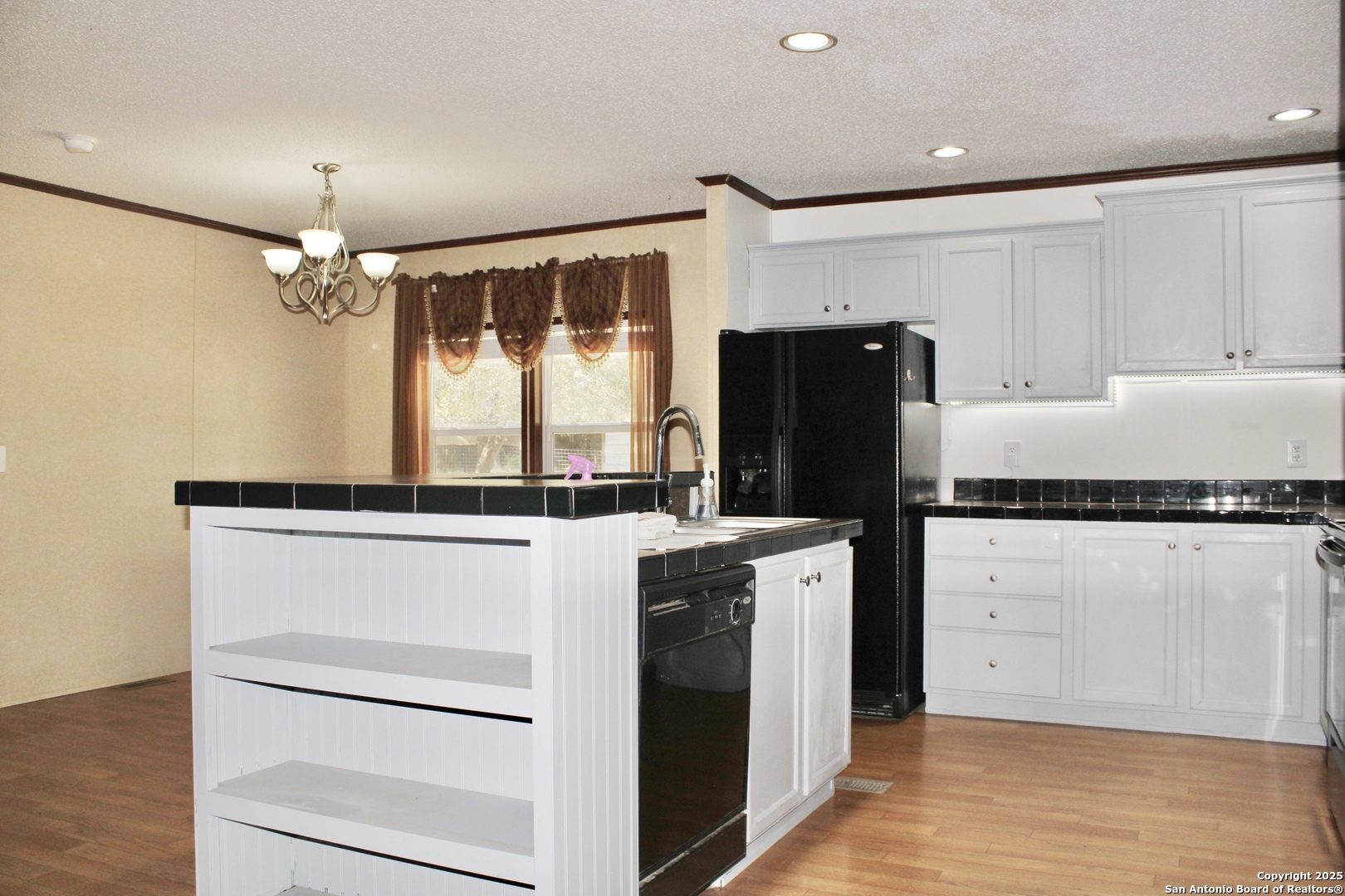 285 Rhonda Drive Lytle, TX 78052 - Photo 38 of 51 a kitchen with stainless steel appliances a refrigerator and a stove top oven
