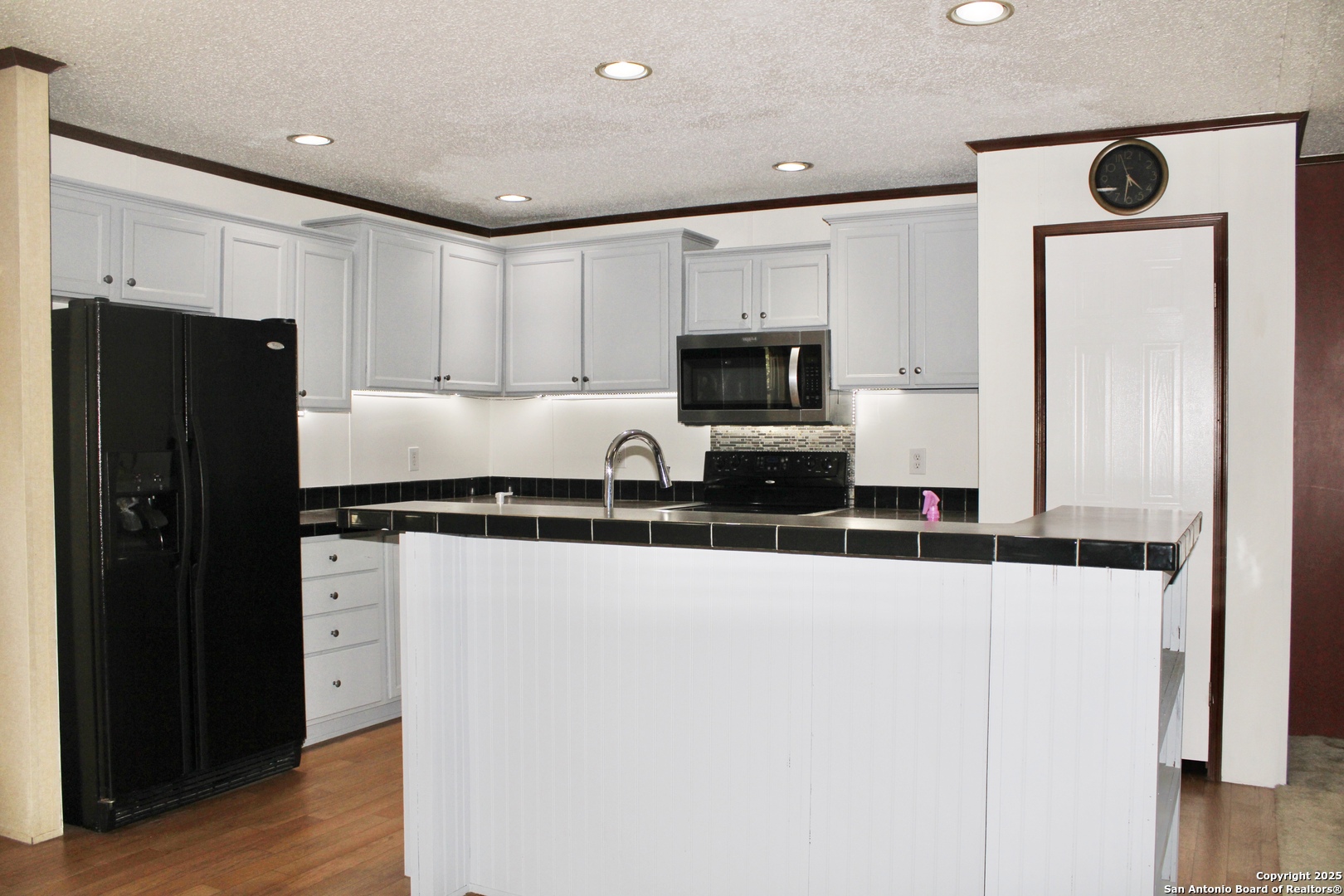 285 Rhonda Drive Lytle, TX 78052 - Photo 39 of 51 a kitchen with stainless steel appliances a refrigerator and a stove