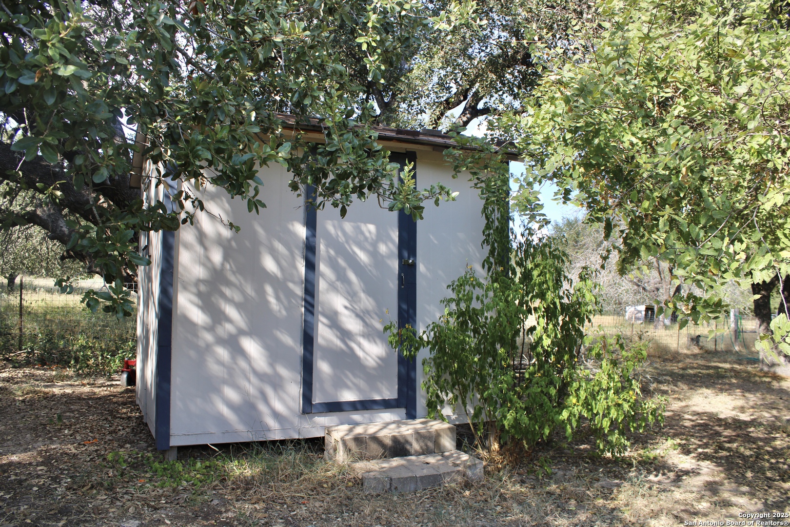 285 Rhonda Drive Lytle, TX 78052 - Photo 45 of 51 a view of a wooden house with large trees