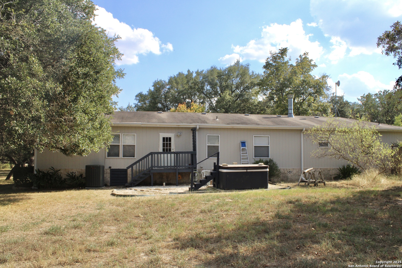 285 Rhonda Drive Lytle, TX 78052 - Photo 48 of 51 a view of a house with a yard and a large tree