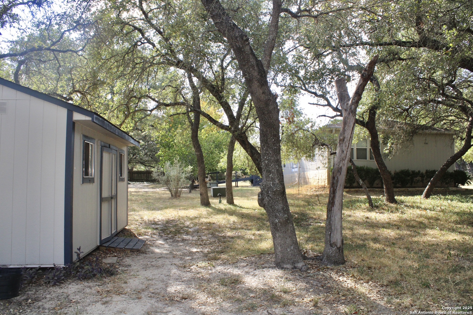 285 Rhonda Drive Lytle, TX 78052 - Photo 51 of 51 a view of a yard with a tree