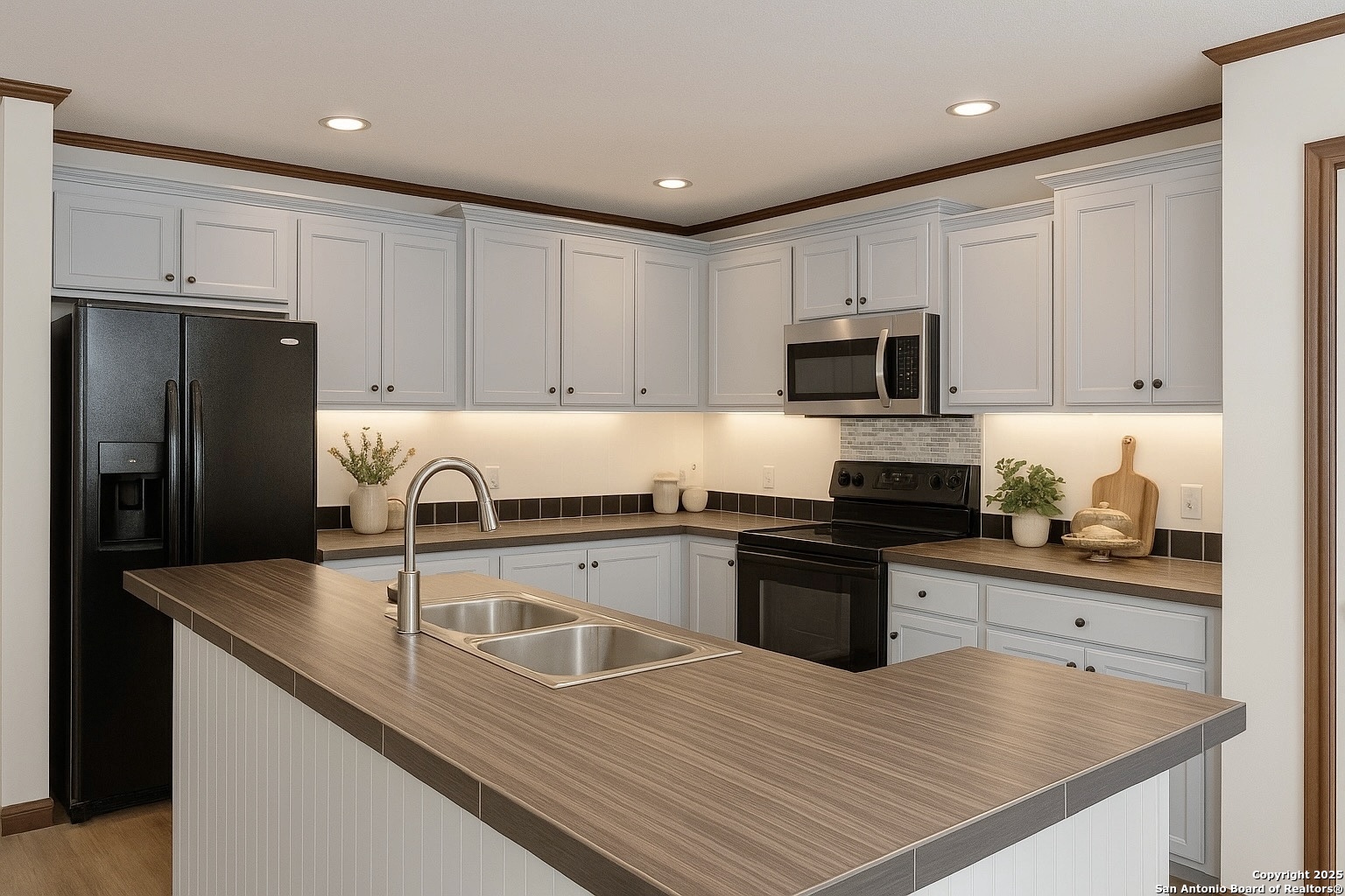 285 Rhonda Drive Lytle, TX 78052 - Photo 6 of 51 a kitchen with granite countertop a refrigerator stove top oven and sink