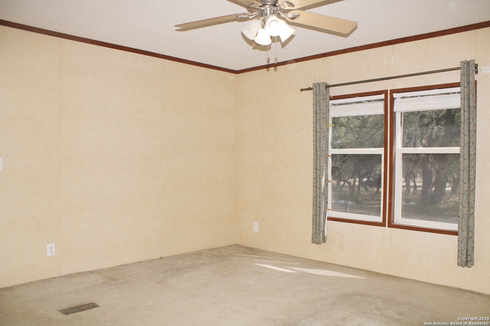 285 Rhonda Drive Lytle, TX 78052 - Photo 9 of 51 a view of an empty room with a window