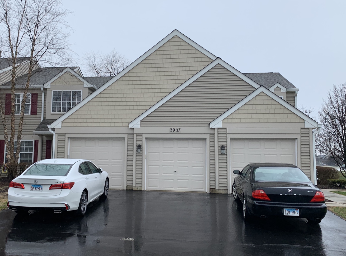 2927 Rutland Circle, Unit 101 Naperville, IL 60564 - Photo 1 of 11 a car parked in front of white house