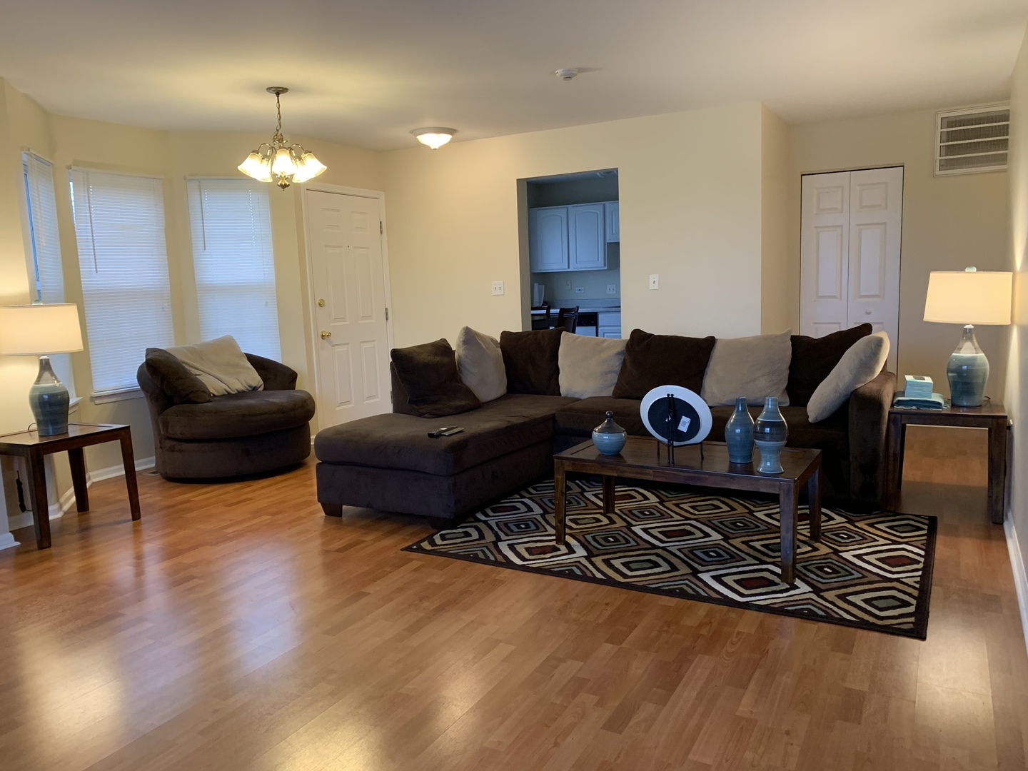 2927 Rutland Circle, Unit 101 Naperville, IL 60564 - Photo 2 of 11 a living room with furniture and a wooden floor