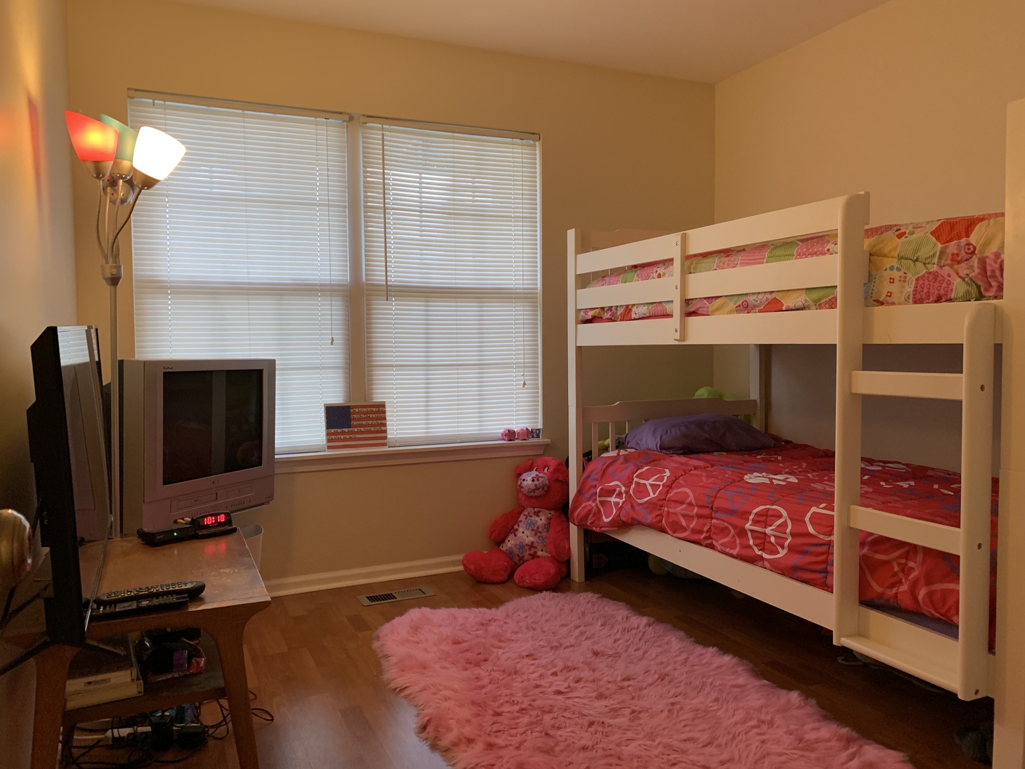 2927 Rutland Circle, Unit 101 Naperville, IL 60564 - Photo 8 of 11 a bedroom with a bed and a flat screen tv