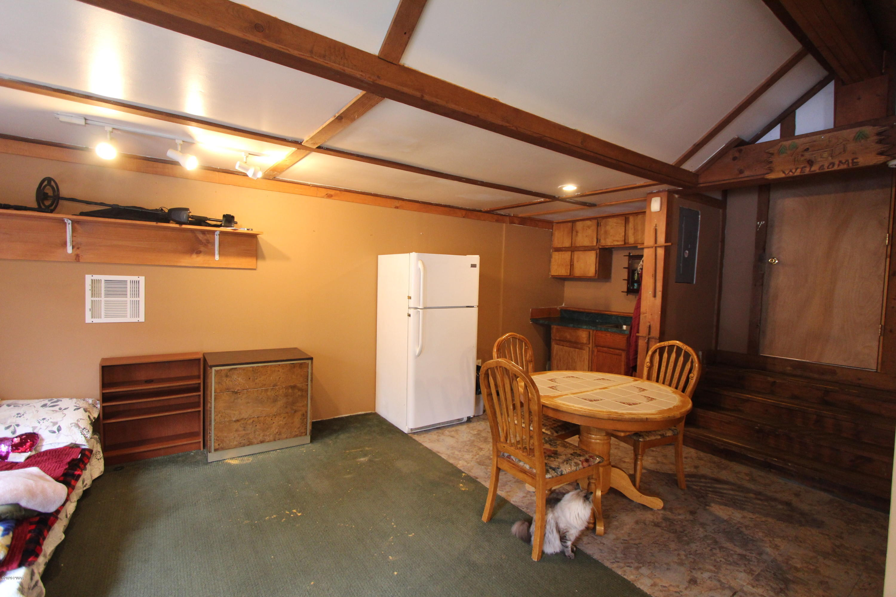 89 Sterling Gardens Road Moscow, PA 18444 - Photo 17 of 22 a room with furniture a rug and a window