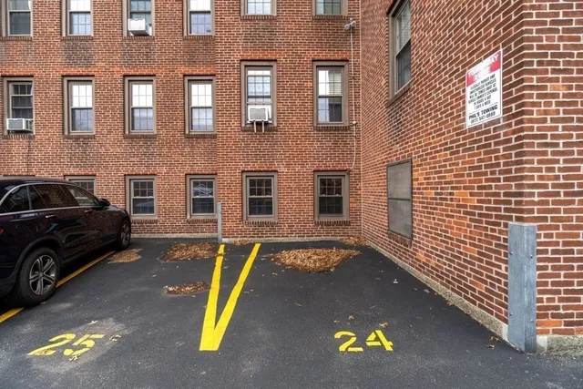 a view of a car park in front of building