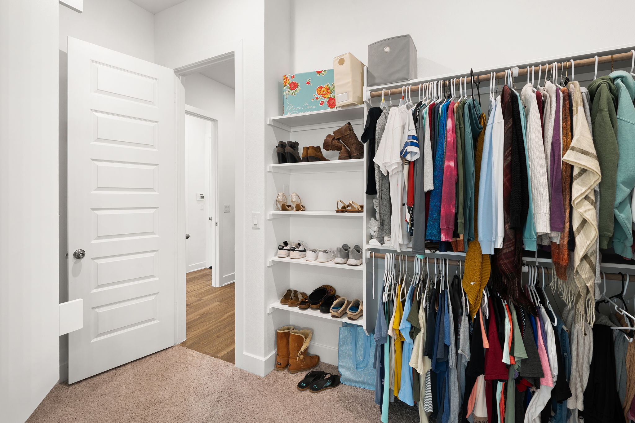 515 Watershield Cove Georgetown, TX 78633 - Photo 22 of 40 Streamlined closet system offers extensive hanging space and convenient shelving for shoes and accessories.