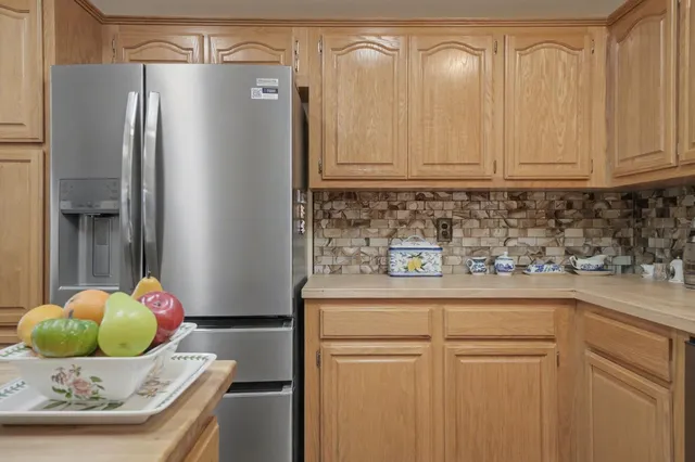 a kitchen with stainless steel appliances granite countertop a sink and cabinets