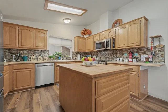 a kitchen with sink cabinets and window