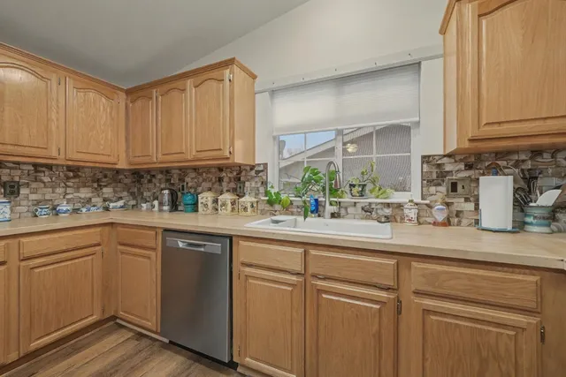 a dining room with furniture a rug and wooden floor