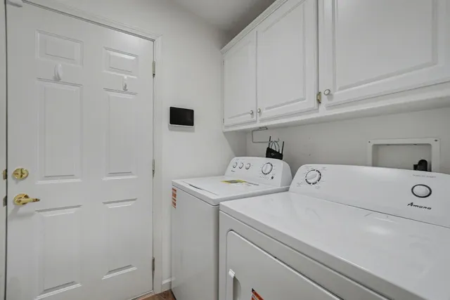 a bedroom with a bed furniture a book shelf and a window