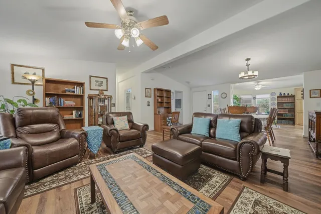 a kitchen with stainless steel appliances a sink a stove cabinets and a counter top space