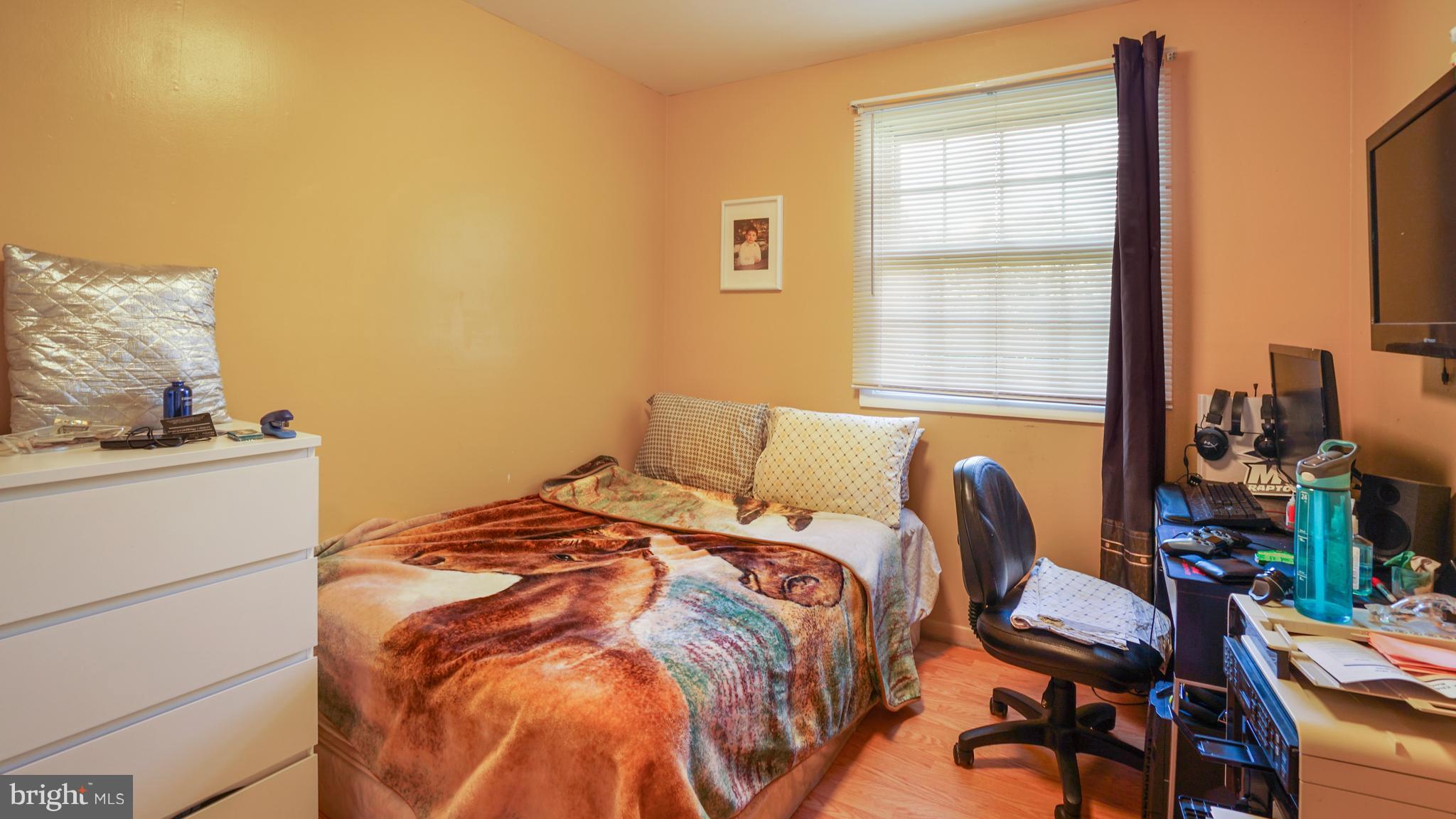 12721 Barbara Road Silver Spring, MD 20906 - Photo 15 of 30 a bedroom with a bed and a window