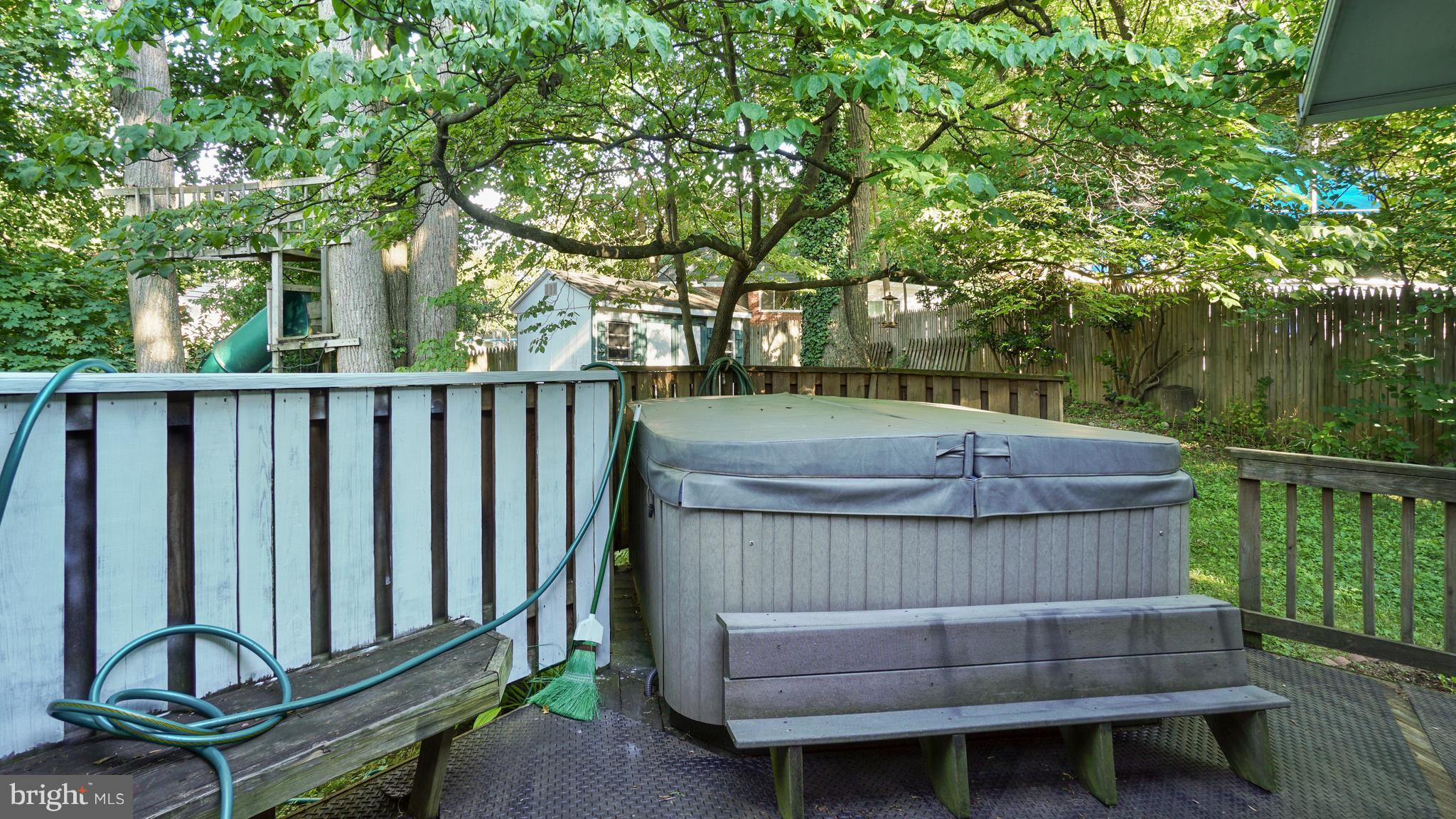 12721 Barbara Road Silver Spring, MD 20906 - Photo 24 of 30 a view of a wooden deck with chairs and a yard