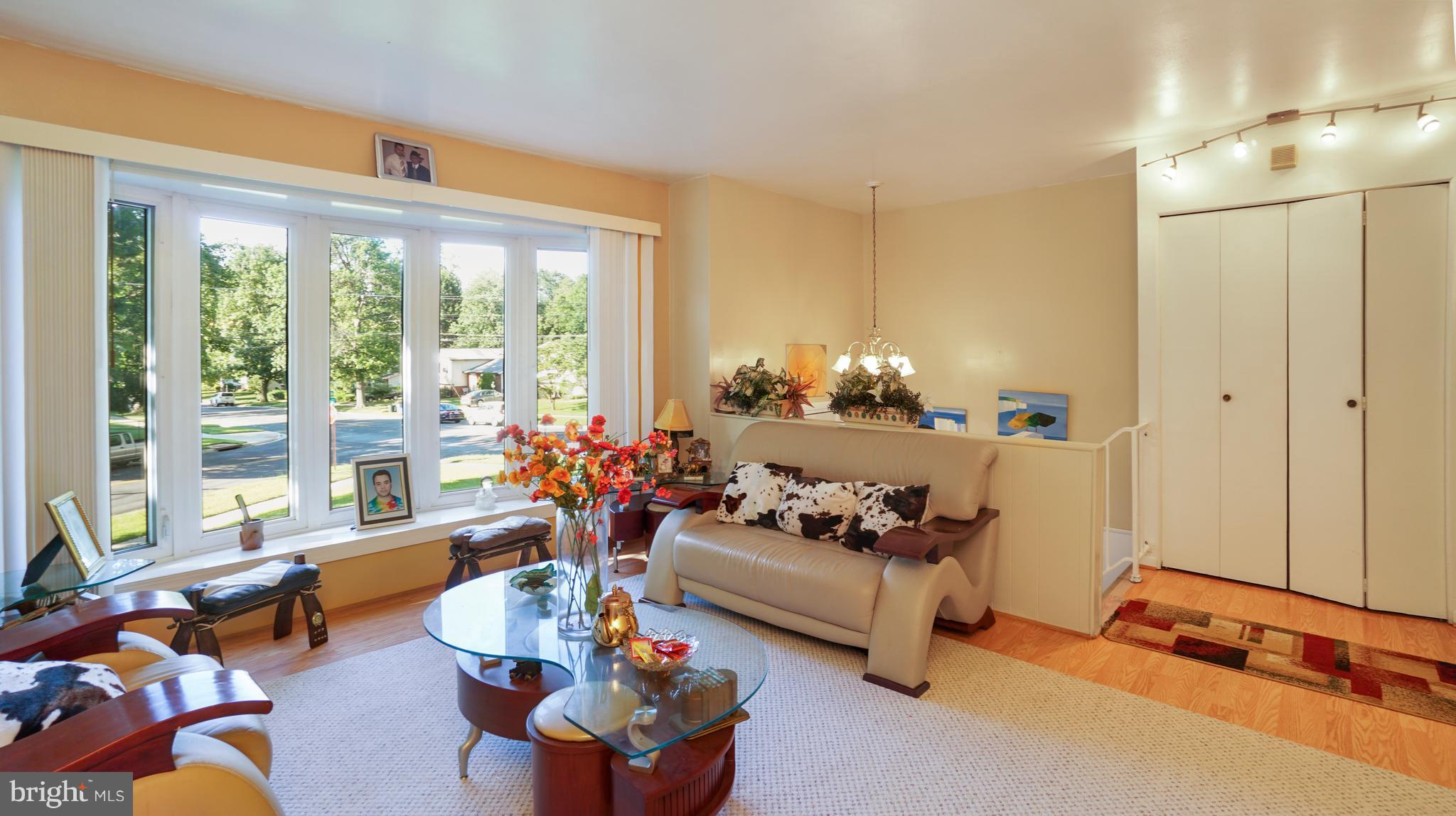 12721 Barbara Road Silver Spring, MD 20906 - Photo 5 of 30 a living room with furniture and a large window