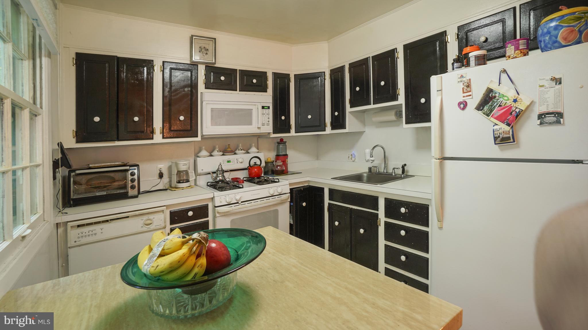 12721 Barbara Road Silver Spring, MD 20906 - Photo 10 of 30 a kitchen with a sink and cabinets