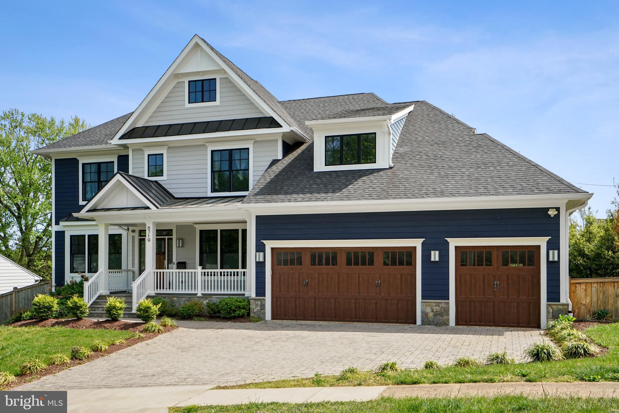 6719 Van Fleet Drive McLean, VA 22101 - Photo 1 of 29 a front view of a house with garden