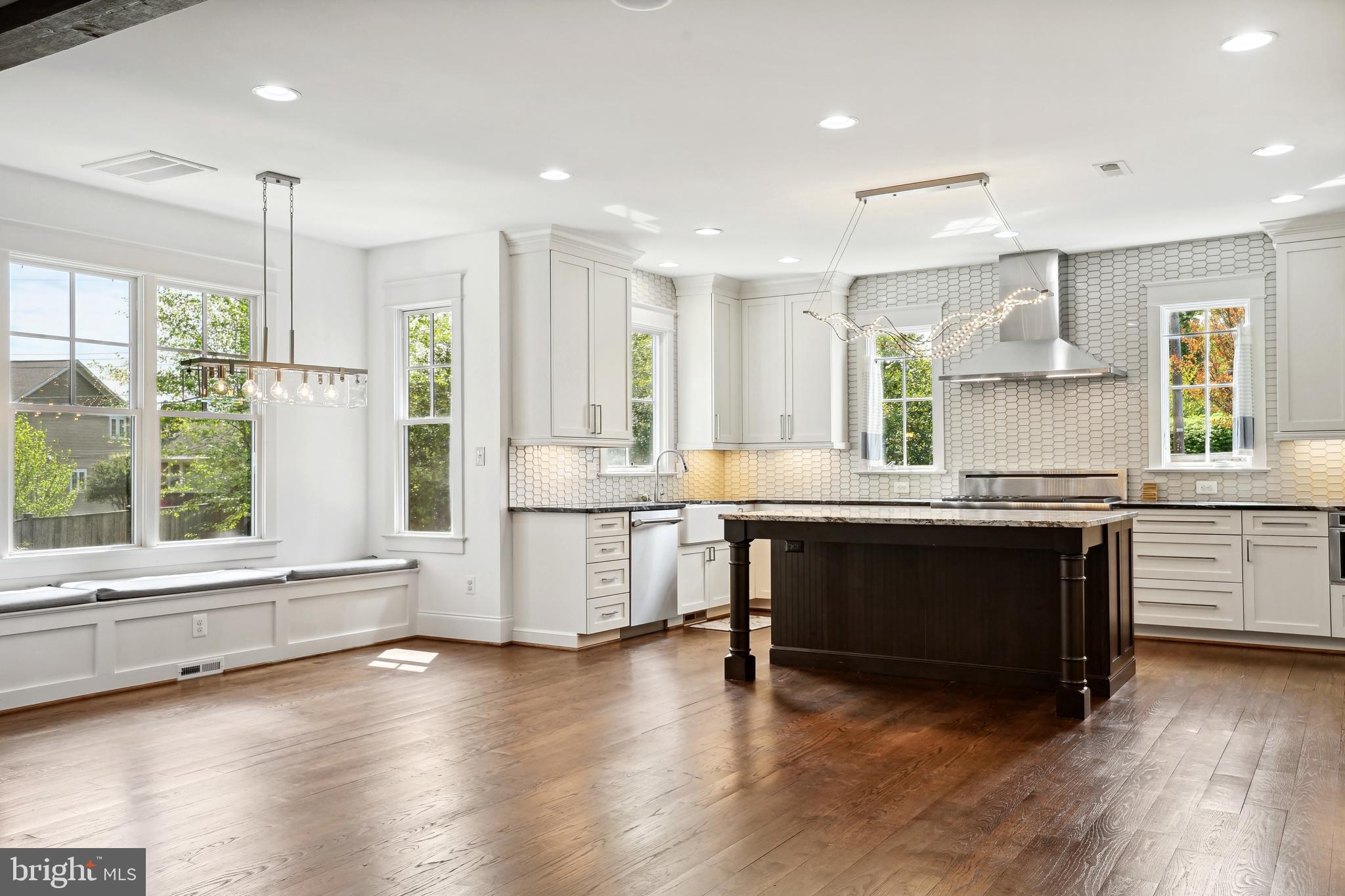 6719 Van Fleet Drive McLean, VA 22101 - Photo 14 of 29 a kitchen with stainless steel appliances granite countertop a stove a sink and a large window