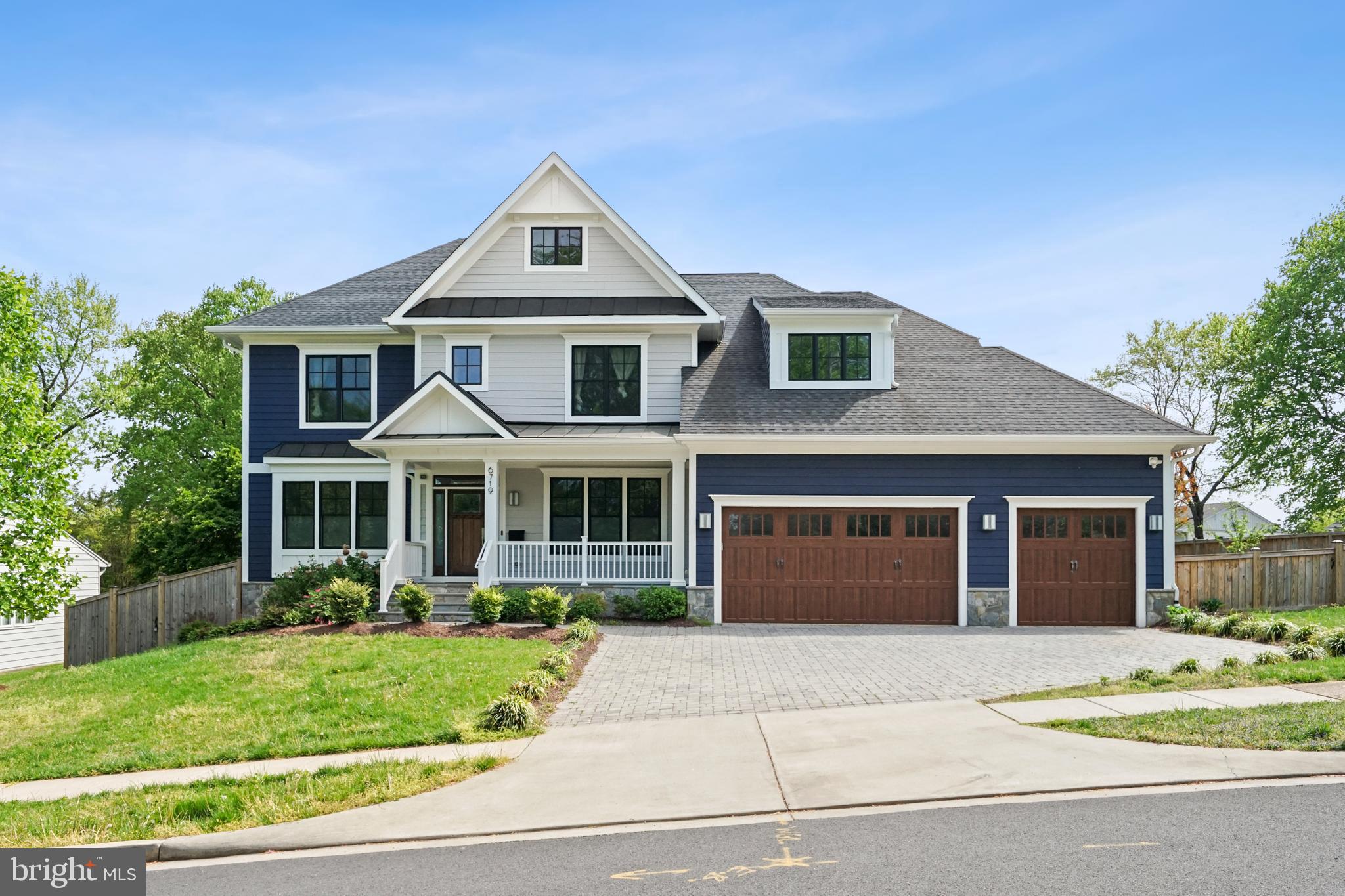 6719 Van Fleet Drive McLean, VA 22101 - Photo 2 of 29 a front view of a house with a garden