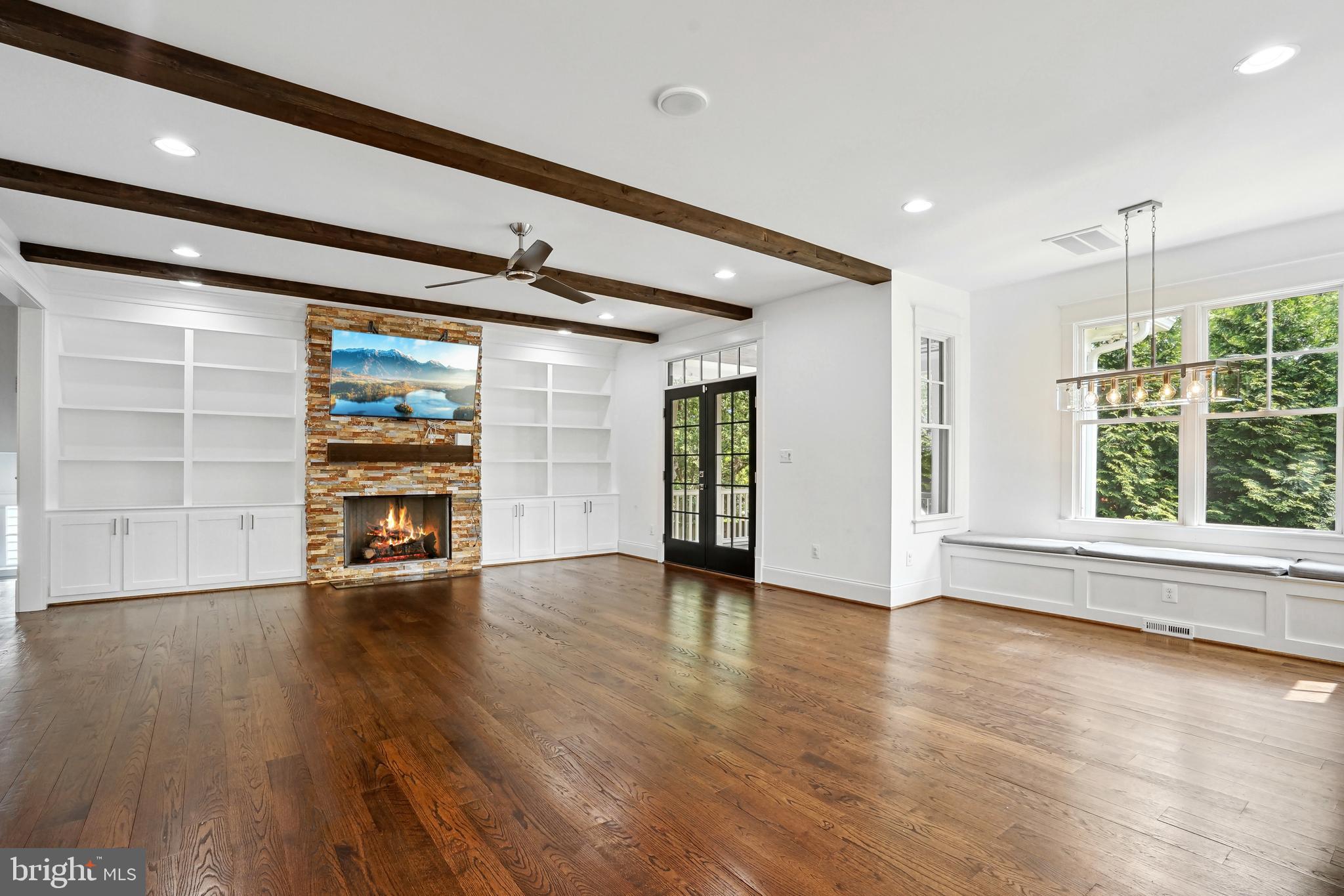 6719 Van Fleet Drive McLean, VA 22101 - Photo 4 of 29 an empty room with wooden floor and windows