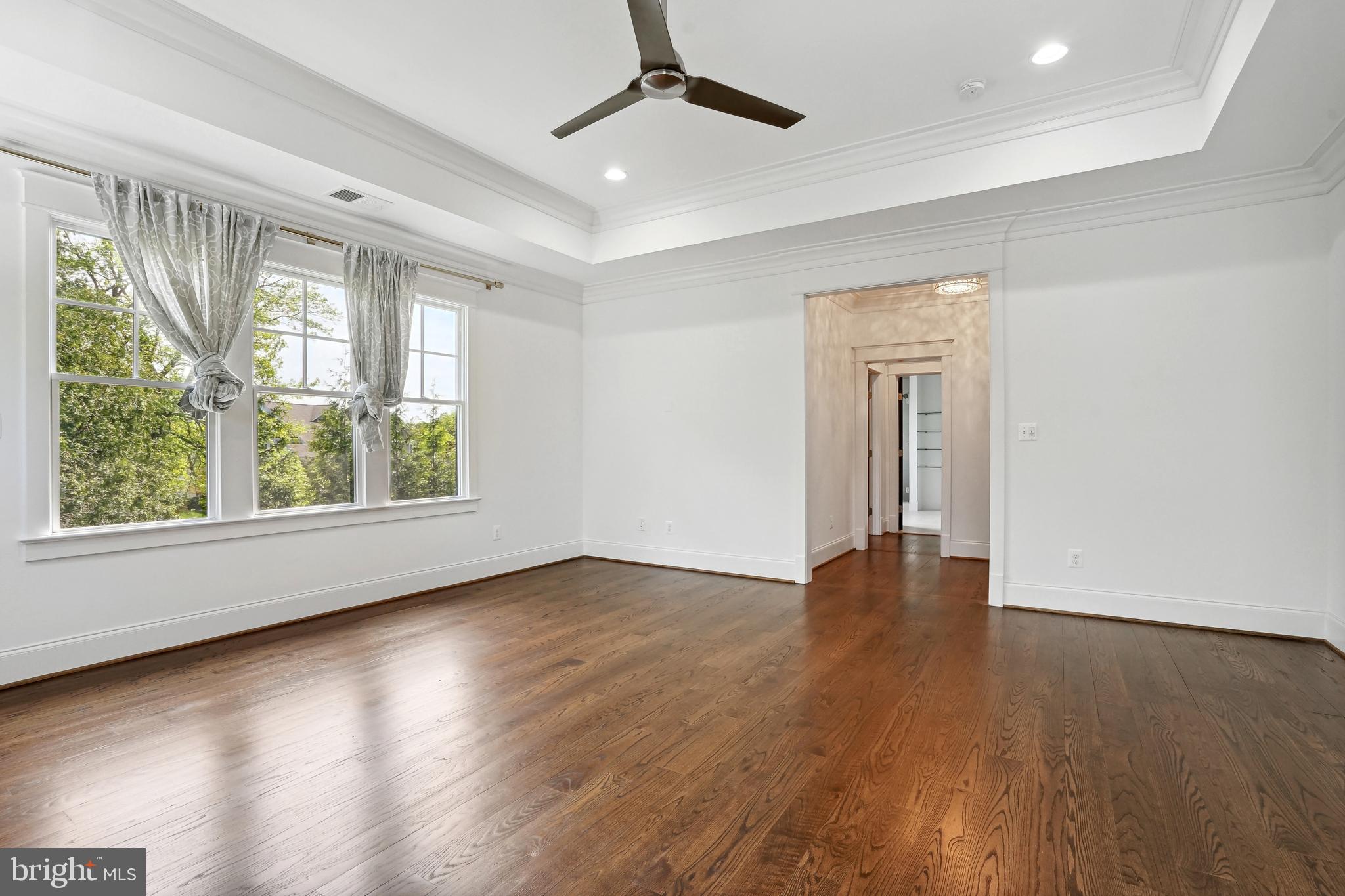 6719 Van Fleet Drive McLean, VA 22101 - Photo 5 of 29 an empty room with wooden floor and windows