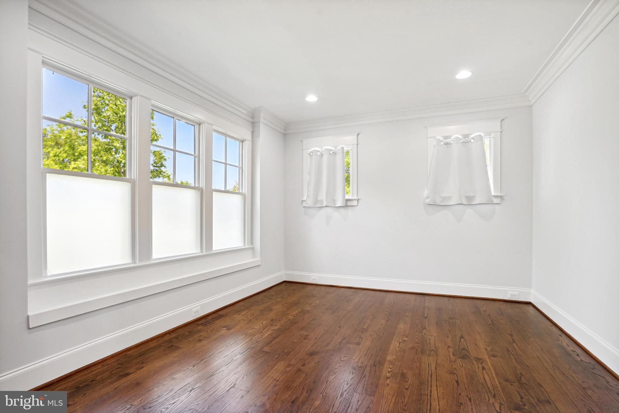 6719 Van Fleet Drive McLean, VA 22101 - Photo 8 of 29 a view of an empty room with wooden floor and a window