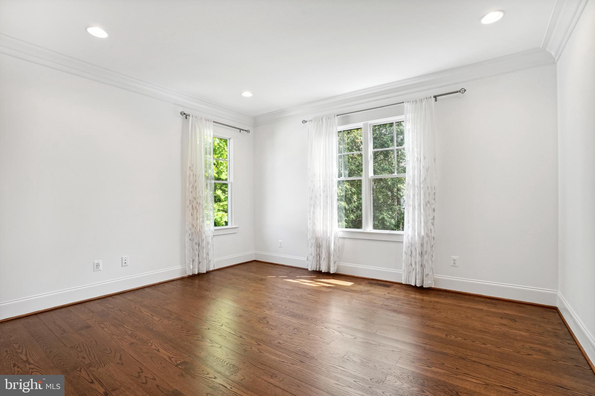 6719 Van Fleet Drive McLean, VA 22101 - Photo 10 of 29 an empty room with wooden floor and windows
