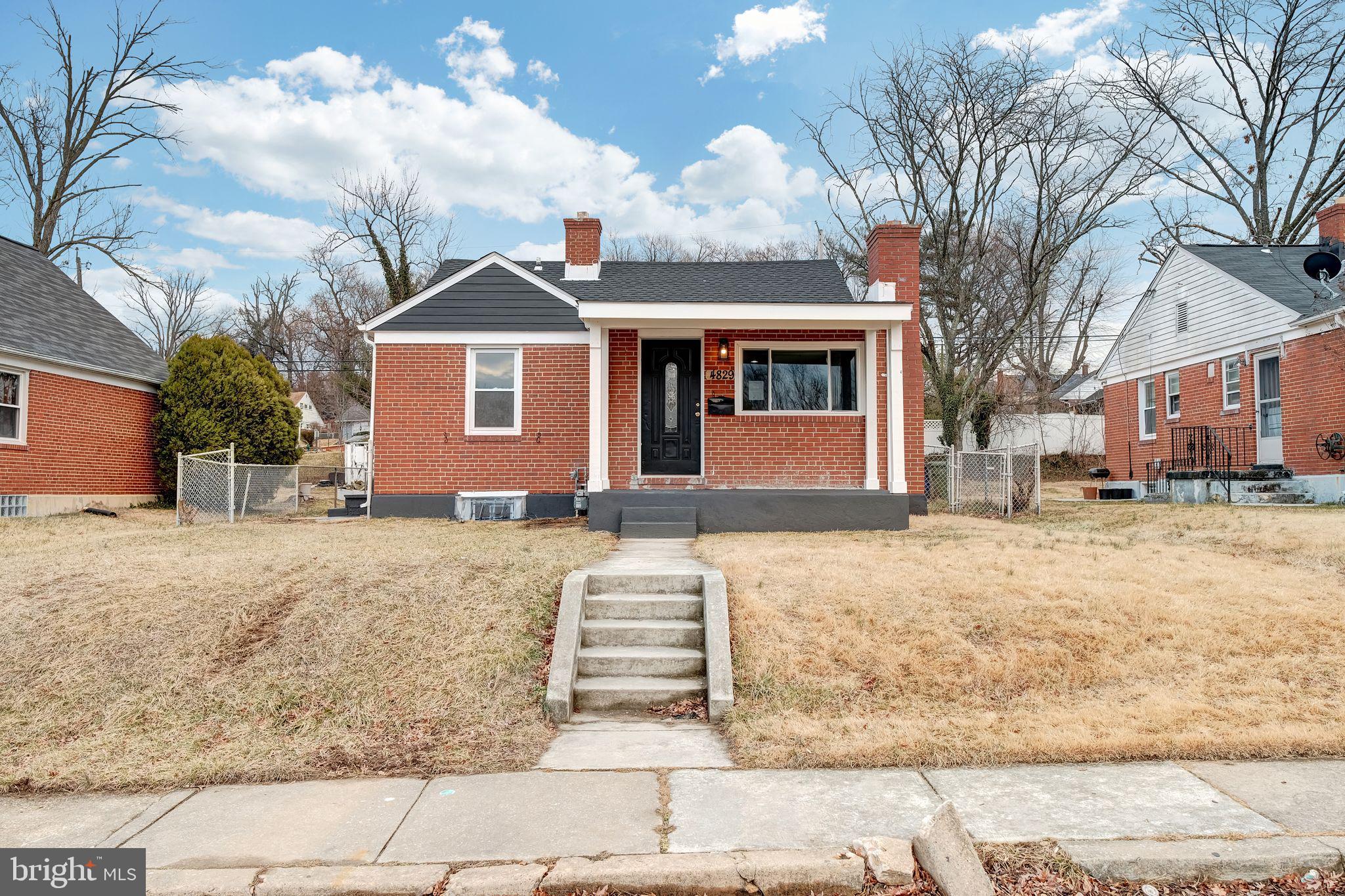 4829 Gilray Drive Baltimore, MD 21214 - Photo 1 of 28 a front view of a house with a yard