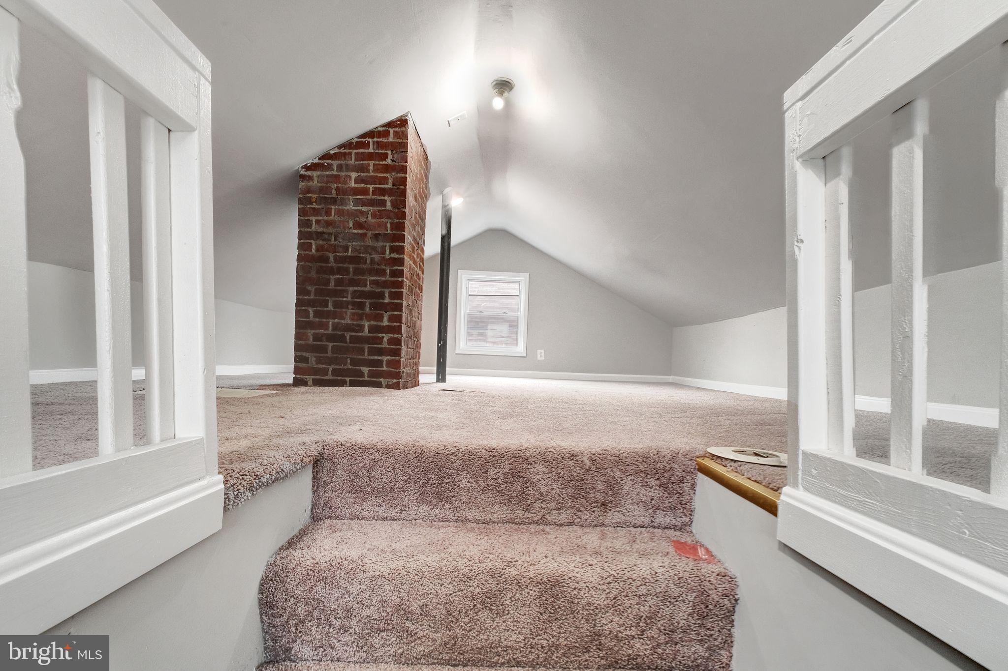 4829 Gilray Drive Baltimore, MD 21214 - Photo 21 of 28 a living room with furniture and a floor to ceiling window