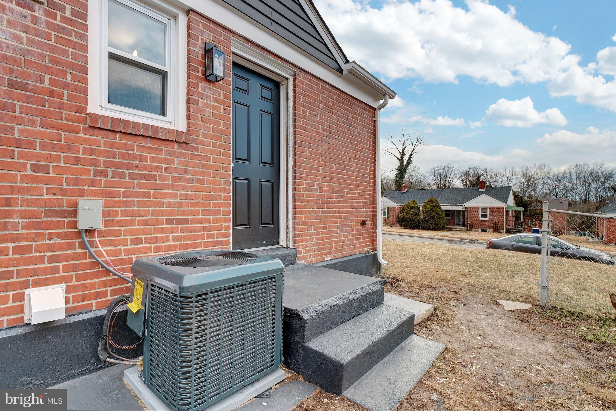 4829 Gilray Drive Baltimore, MD 21214 - Photo 25 of 28 a view of brick house with many windows