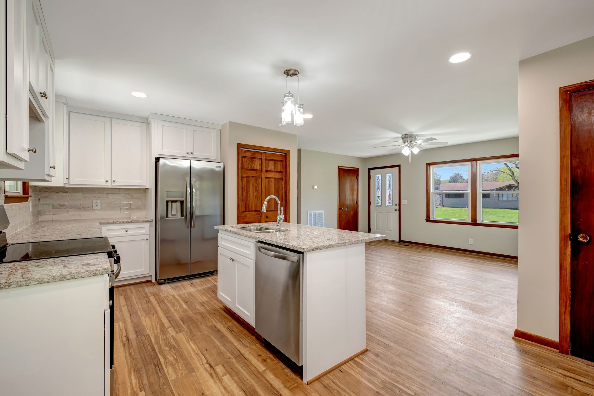 5010 Bonnameade Drive Hermitage, TN 37076 - Photo 11 of 27 a kitchen with stainless steel appliances granite countertop a refrigerator a stove and a wooden floors