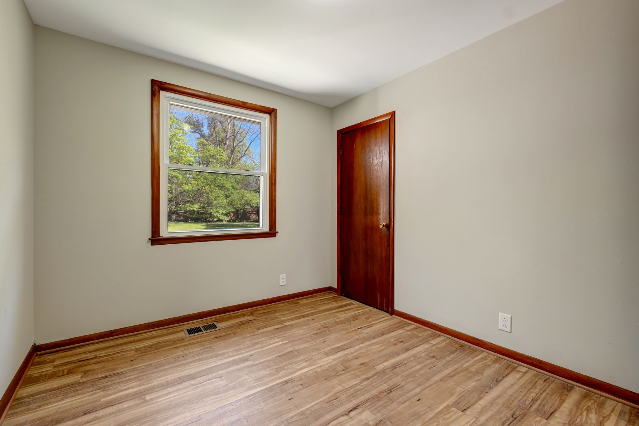 5010 Bonnameade Drive Hermitage, TN 37076 - Photo 16 of 27 a view of an empty room with wooden floor and a window