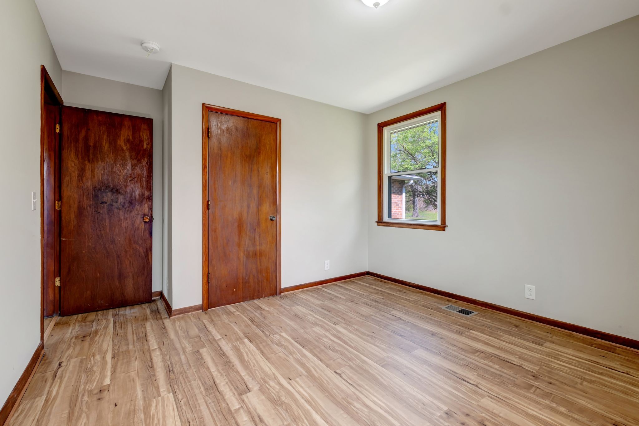 5010 Bonnameade Drive Hermitage, TN 37076 - Photo 17 of 27 a view of an empty room with wooden floor and a window