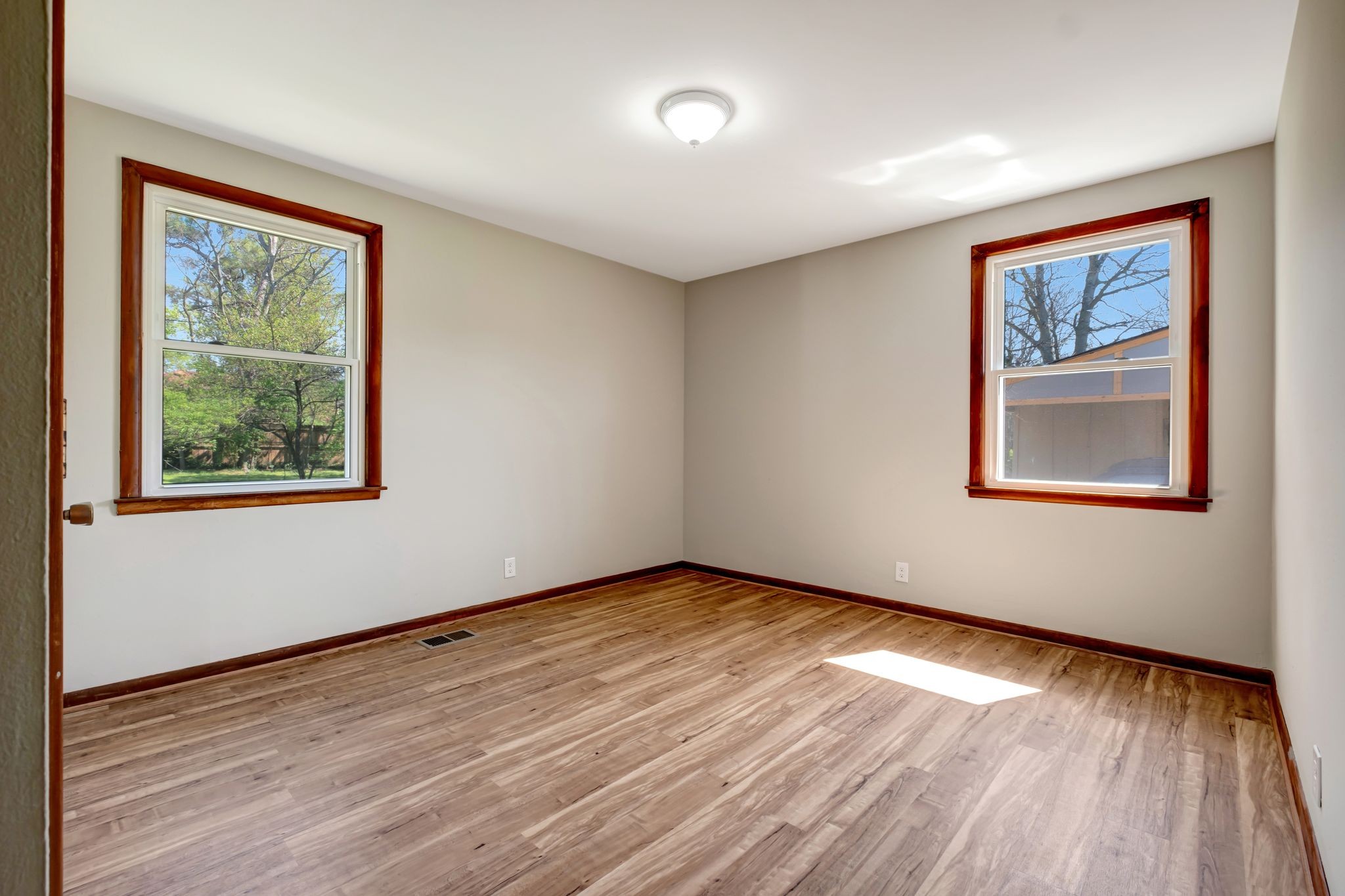 5010 Bonnameade Drive Hermitage, TN 37076 - Photo 19 of 27 a view of an empty room with wooden floor and a window