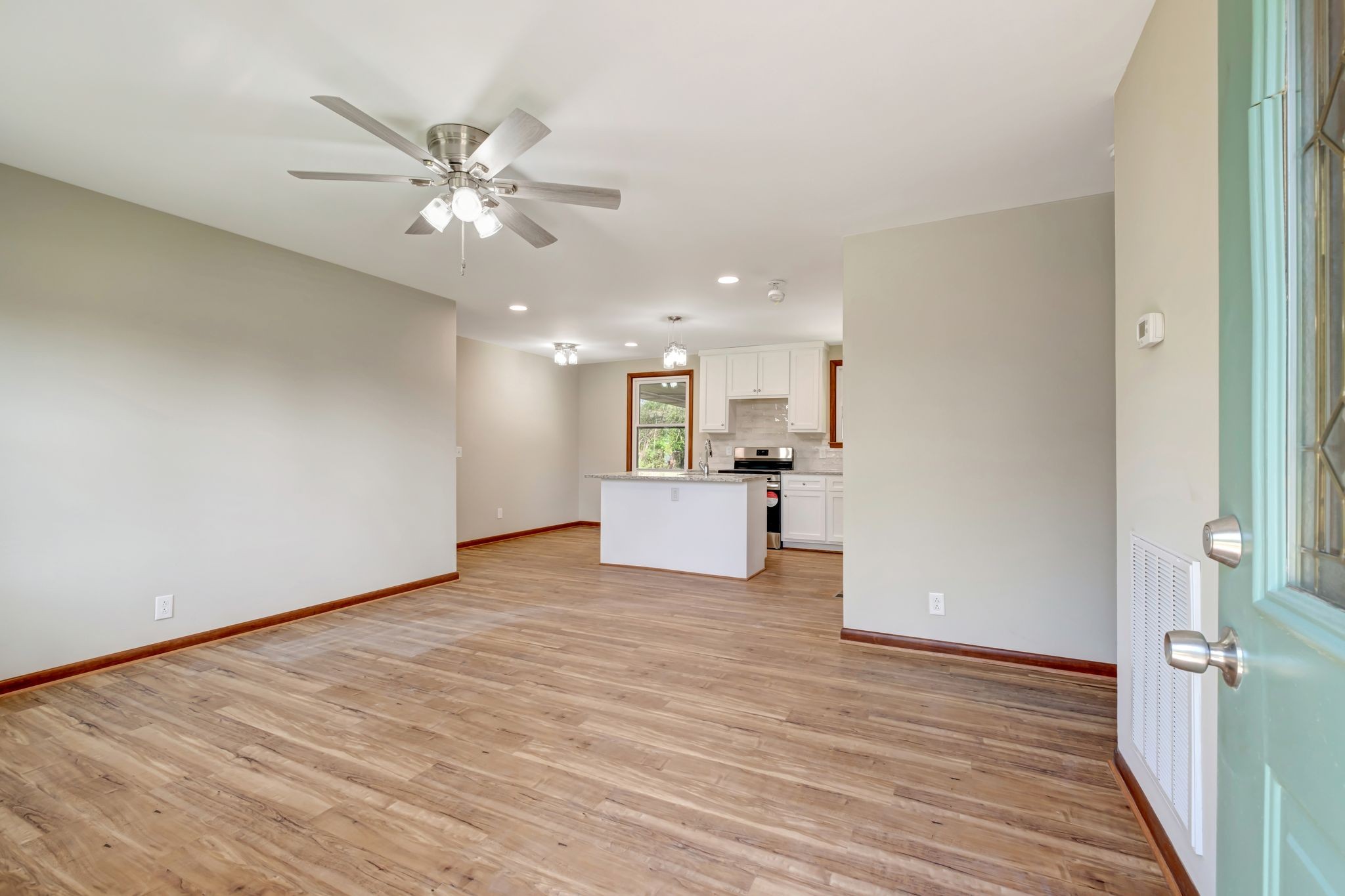 5010 Bonnameade Drive Hermitage, TN 37076 - Photo 5 of 27 a view of a kitchen with wooden floor and a ceiling fan