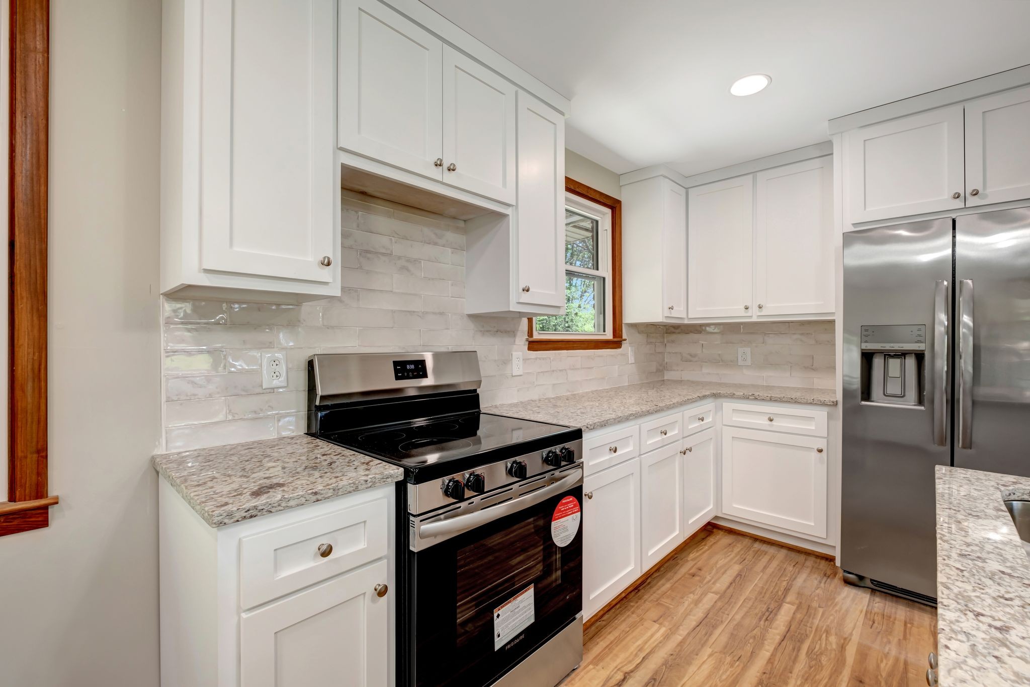 5010 Bonnameade Drive Hermitage, TN 37076 - Photo 9 of 27 a kitchen with granite countertop cabinets stainless steel appliances and wooden floor