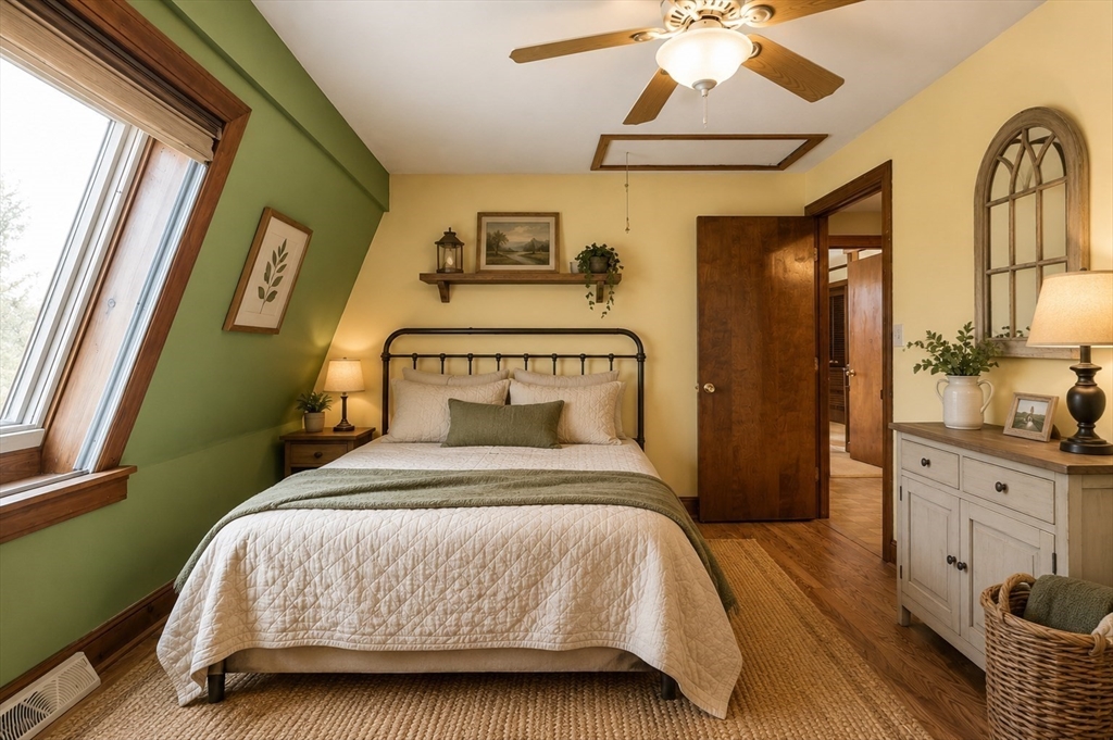 8 Portsmouth Road Amesbury, MA 01913 - Photo 24 of 37 a bedroom with a bed and a chandelier