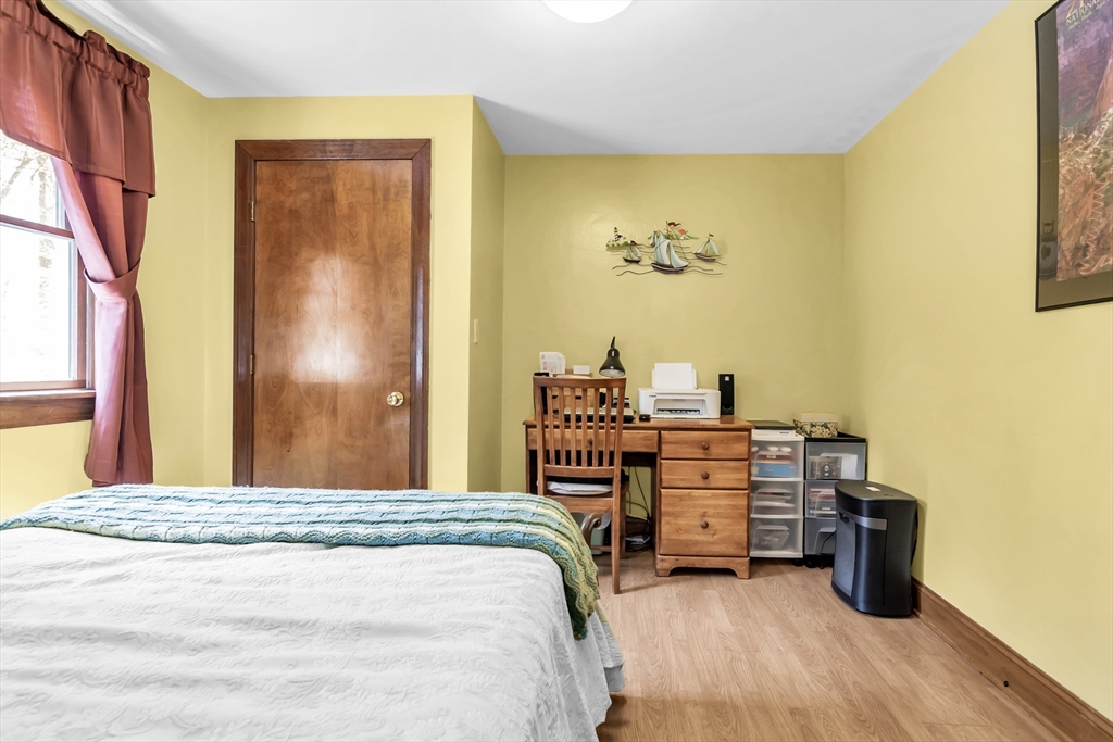 8 Portsmouth Road Amesbury, MA 01913 - Photo 27 of 37 a bedroom with a bed and a desk